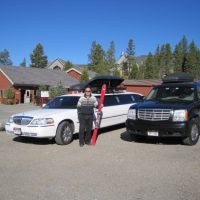 Stagecoach fleet limos parked next to old school house in Breckenridge, Colorado